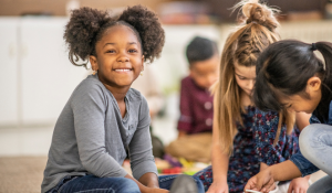 Diverse K-12 Students Working on a project together in a classroom