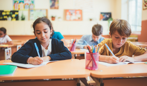 Diverse students in the classroom working on their assignments
